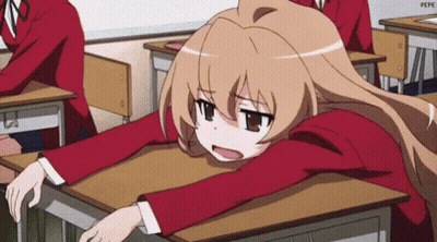 Girl Sitting At Desk With Head On Desk GIF