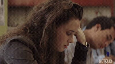 Girl Sitting At Desk With Netflix Logo GIF