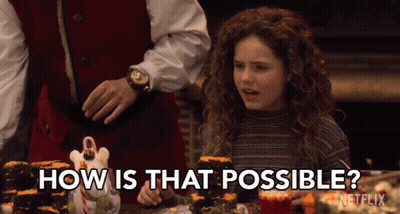 Girl Sitting at Table Saying How Is That Possible