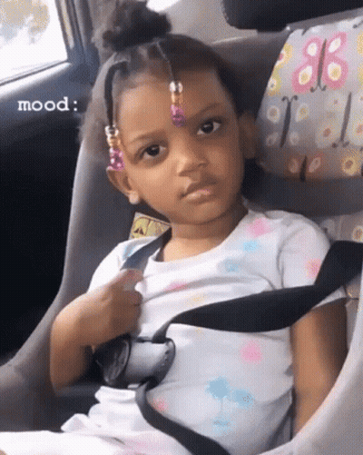 Girl Sitting In Car Seat Making Funny Face GIF