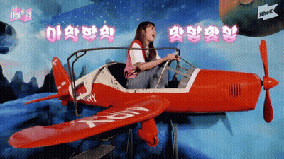 Girl Sitting In Red Airplane With T & R GIF