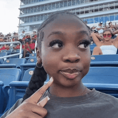 Girl Sitting In Stadium With E1 Sticker GIF