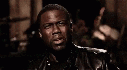 Girl Sitting On Bed Surrounded By People GIF