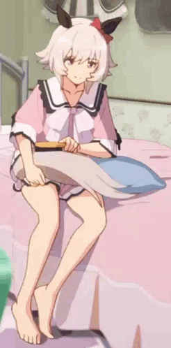 Girl Sitting On Bed With Pillow And Brush GIF