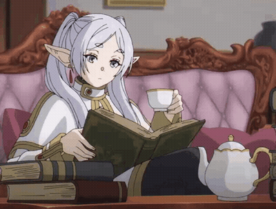 Girl Sitting On Couch Reading Book GIF