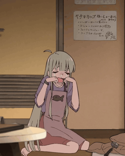 Girl Sitting On Floor With ヤチョカップ Sign GIF