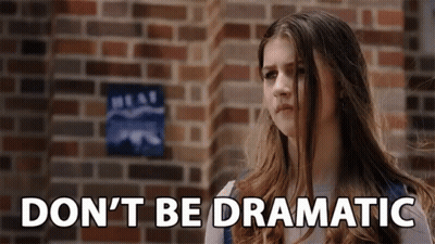 Girl Standing Before Brick Wall With Dnt Be Dramatic GIF