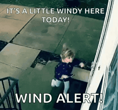Girl Standing By Window During Wind Alert GIF