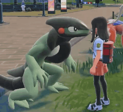 Girl Standing In Front Of Green And Black Monster GIF