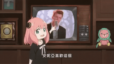 Girl Standing In Front Of TV Holding Cell Phone GIF