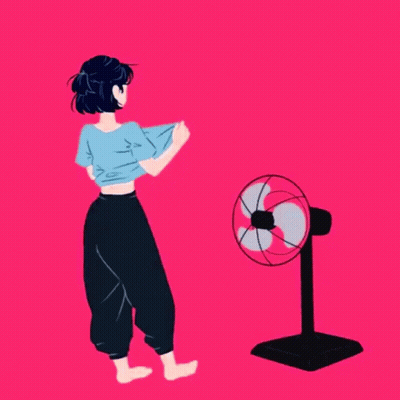 Girl Standing Next to Fan on Pink