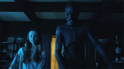 Girl Standing Next To Skeleton Monster GIF