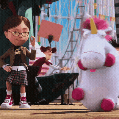 Girl Standing Next To Stuffed Unicorn GIF