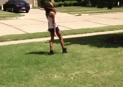 Girl Standing On Grass In Front Of Car GIF