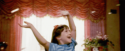 Girl Standing With Arms Outstretched GIF