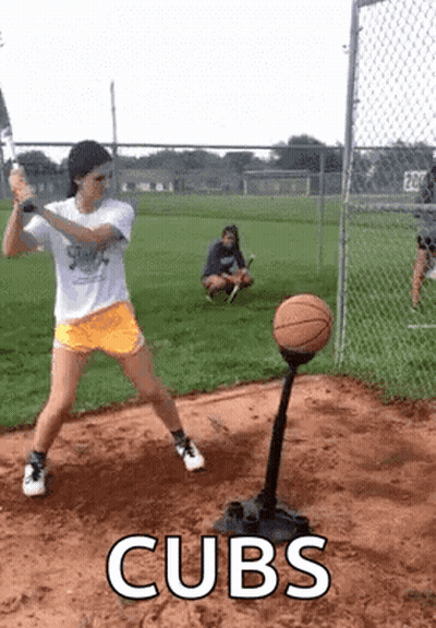 Girl Swinging Bat At Basketball On Tee While Another Watches GIF