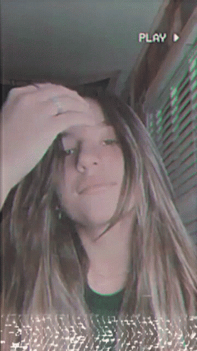 Girl Taking Selfie With Play Button GIF