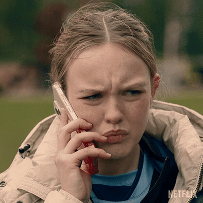 Girl Talking On Cell Phone With Netflix GIF