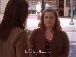 Girl Thinking To Giving Flowers GIF