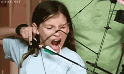 Girl Use Bow And Arrow For Missing Teeth Removal GIF