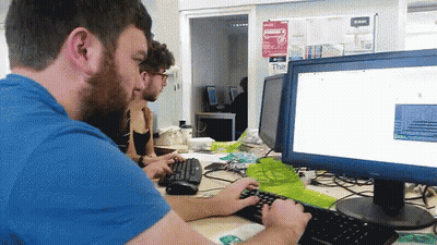 Girl Using Pink Laptop With Facebook Open GIF