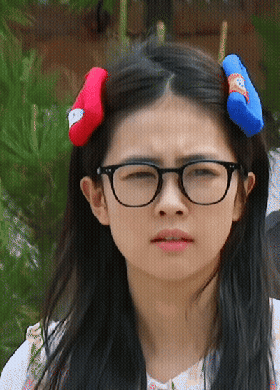 Girl Wearing Glasses And Red Blue Headband GIF