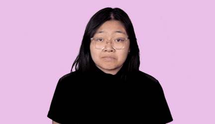 Girl Wearing Glasses Shrugs GIF