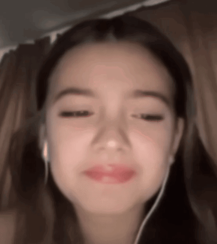 Girl Wearing Headphones Making Funny Face GIF