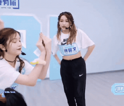 Girl Wearing Nike Shirt With Chinese Writing GIF