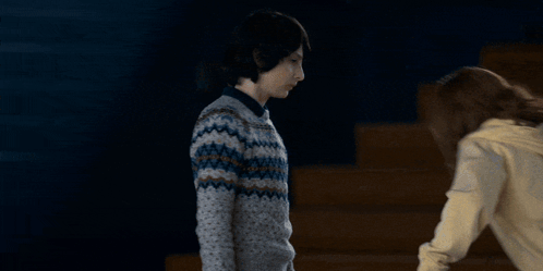 Girl With Arms Outstretched In Gym GIF