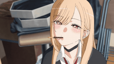 Girl With Blonde Hair And Red Eyes Eating Chocolate Bar GIF