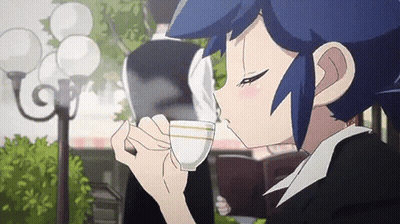 Girl With Blue Hair Drinking Tea While Reading Book