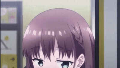 Girl With Braided Haircut Looking At Camera GIF
