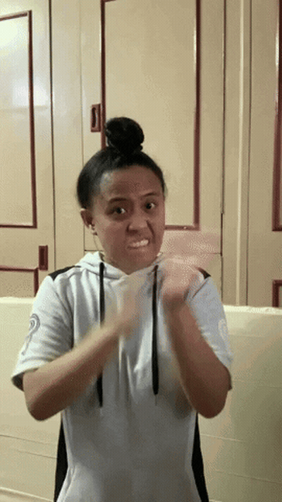 Girl With Bun Making Funny Face GIF