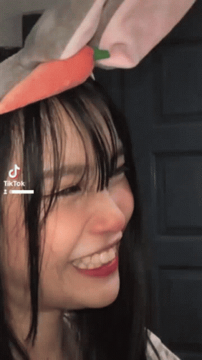 Girl With Bunny Ears And Carrot On Head GIF