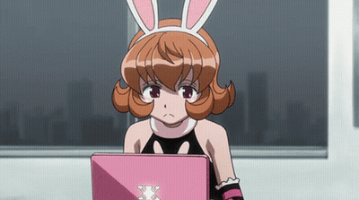 Girl With Bunny Ears Looking At Laptop GIF