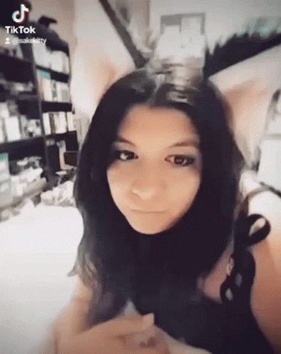 Girl With Cat Ear Headband And TikTok Icon GIF