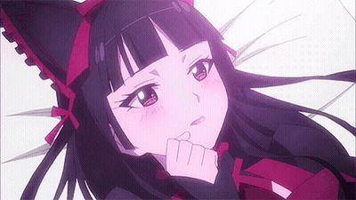 Girl With Cat Ear Headband Laying Down Hand On Chin GIF