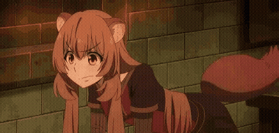 Girl With Cat Tail Sitting By Brick Wall GIF