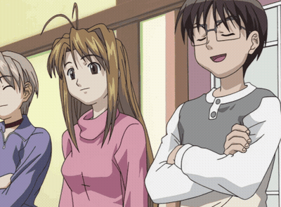 Girl With Cross On Chest Next To Boy With Arms Crossed GIF