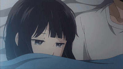 Girl With Cross On Forehead Laying Next To Man GIF