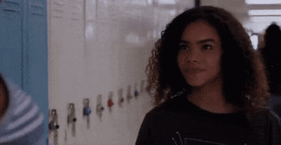 Girl With Curly Hair By School Lockers GIF