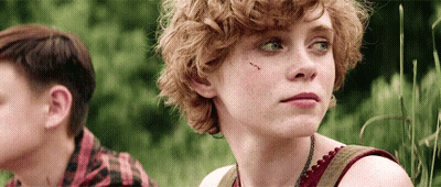 Girl With Curly Hair Next To Boy In Plaid Shirt GIF
