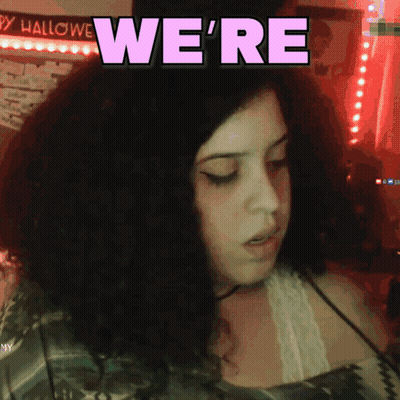 Girl With Curly Hair Says We're In Purple Letters GIF