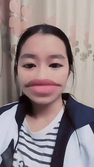 Girl With Fake Mustache And Striped Shirt GIF