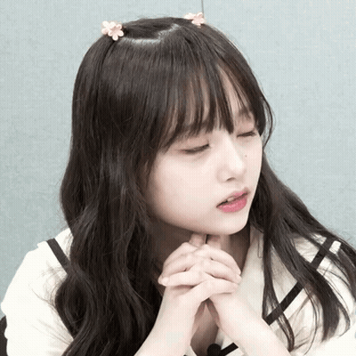 Girl With Flower In Hair And Eyes Closed GIF