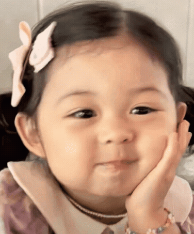 Girl With Flower Making Funny Face GIF