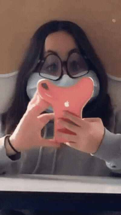 Girl With Glasses And Mask Holding Apple Phone GIF