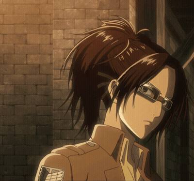 Girl With Glasses And Ponytail Standing In Front Of Wall GIF