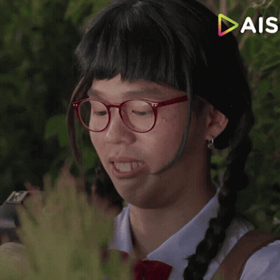 Girl With Glasses And Wig Looking At Phone GIF